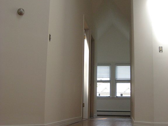 Coming upstairs into unit. Very High ceilings, lots of light