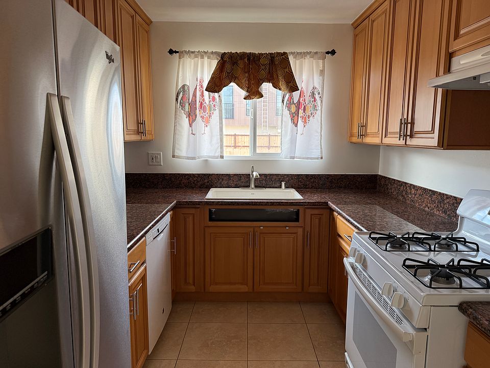 Updated kitchen with side by side refrigerator & freezer with ice maker, dishwasher, stove top and oven. Plenty of cabinet space.