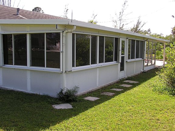 Back of house with one acre