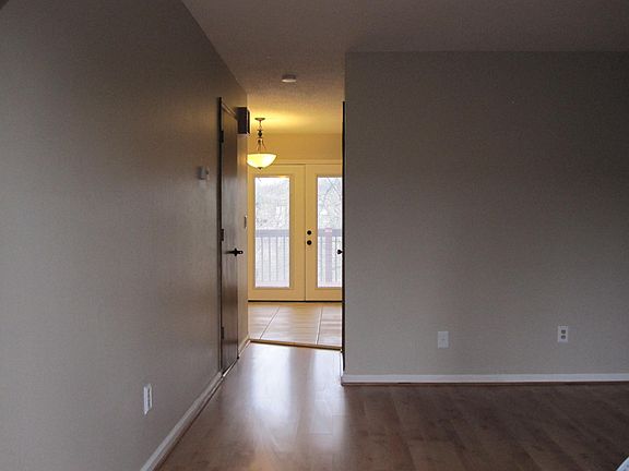 Looking from front to kitchen/dining & french door to deck