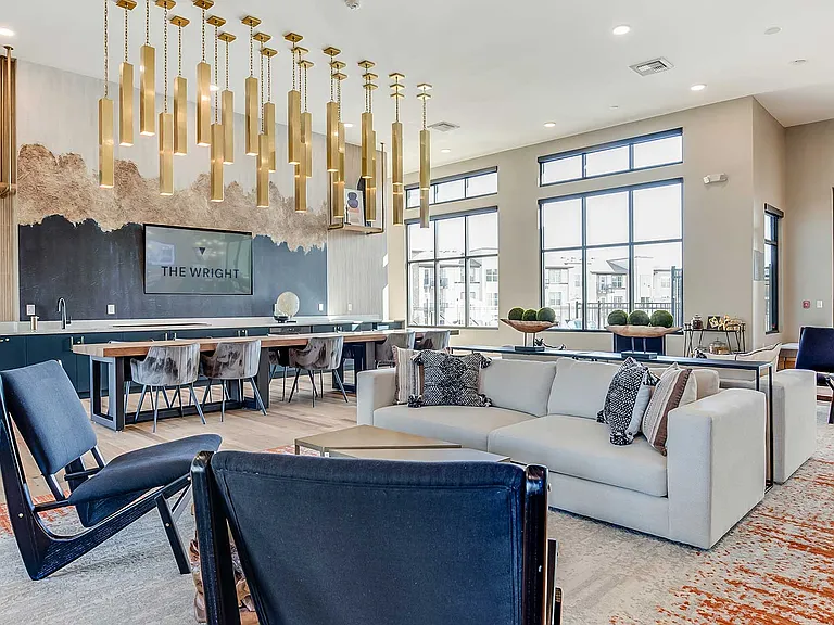 The Wright's modern clubhouse features comfortable lounge seating, collaborative gathering spaces, and contemporary design throughout.
