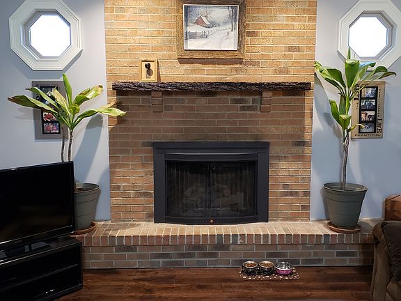 Fireplace with walnut mantle