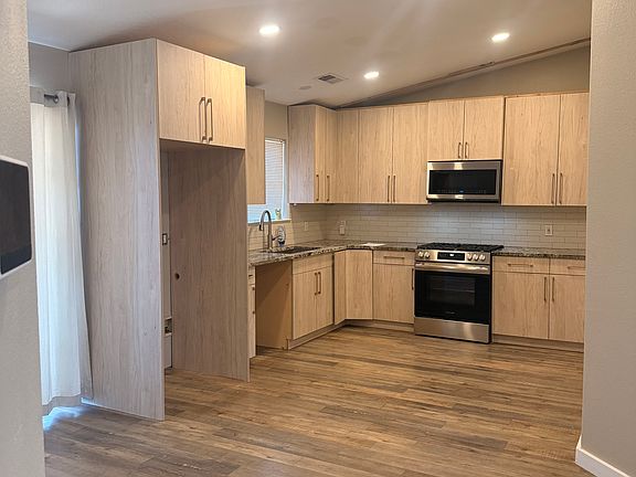 Kitchen, fridge and dishwasher waiting on arrival