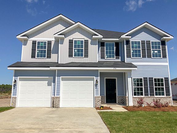 Kohen vinyl with brick skirt front exterior