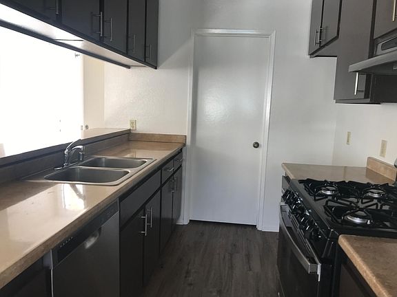 Kitchen and door to laundry and storage area