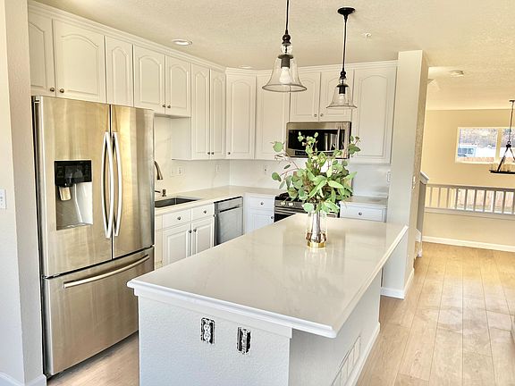 Brand new quartz counter tops and back splash with Samsung Appliances