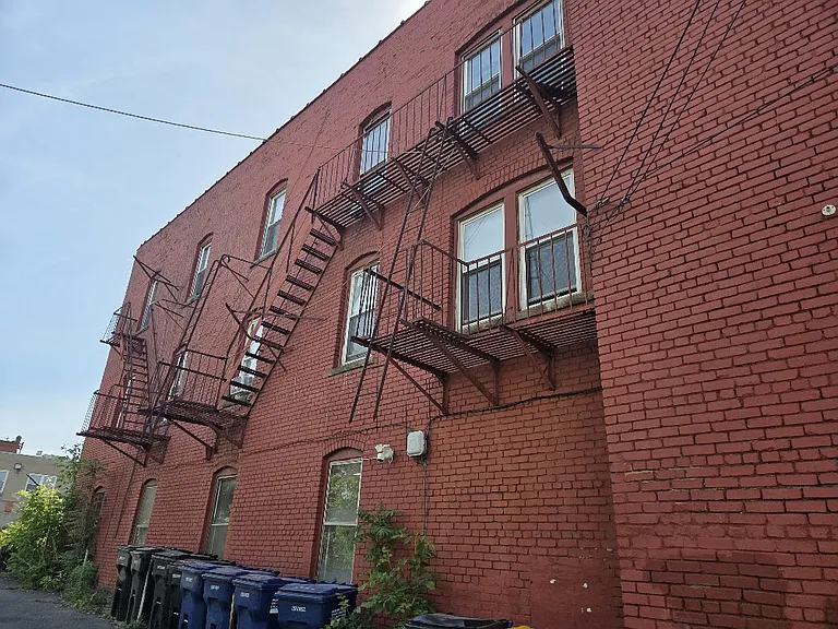 Side of the building, showing the emergency exit balcony.