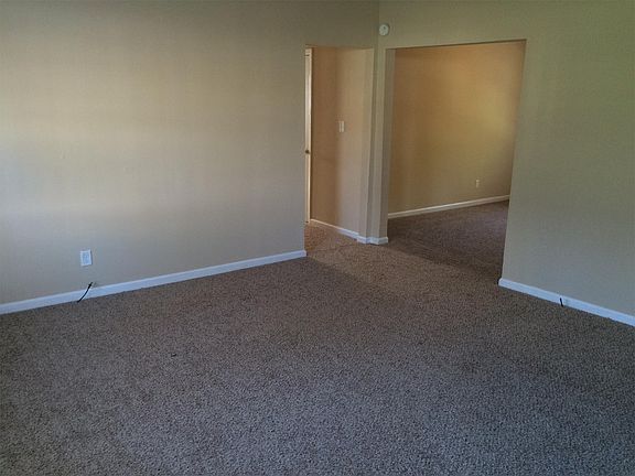 Living room to hallway and dining area