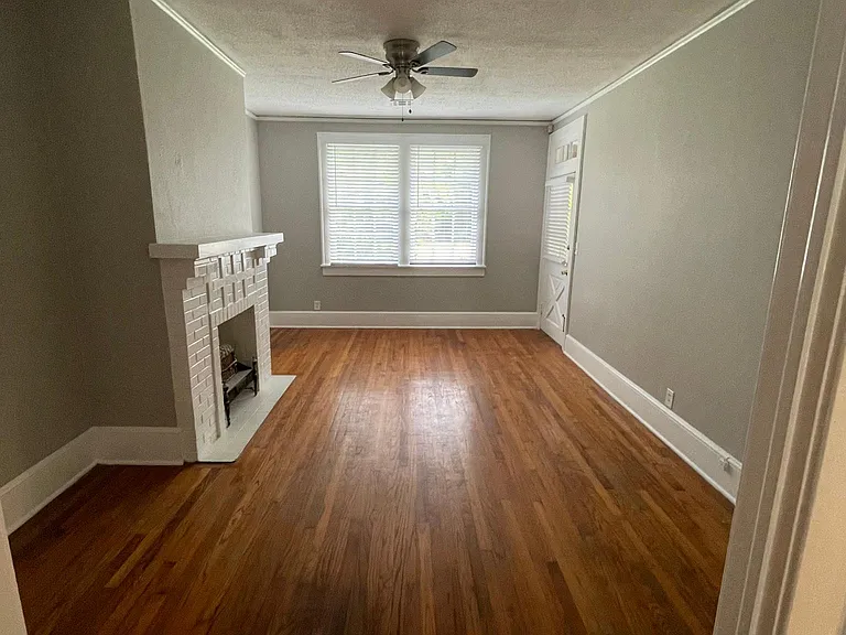 View of living room and front door from dining room