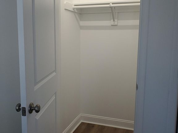 deep, lighted closet in bedroom