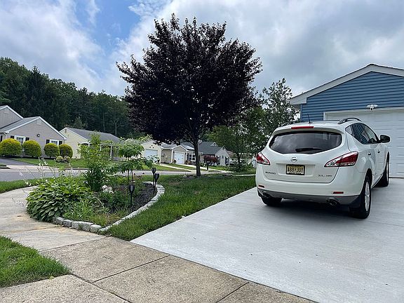 Front. New driveway and gard