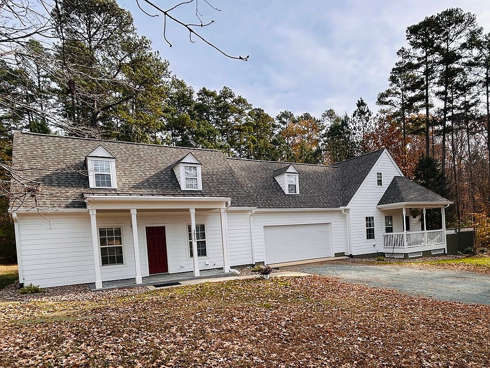 This home for rent includes the house on the left and the 2 car attached garage. The small unit on left is a rented ADU.