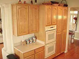 kitchen with wall ovens and oak cabinets