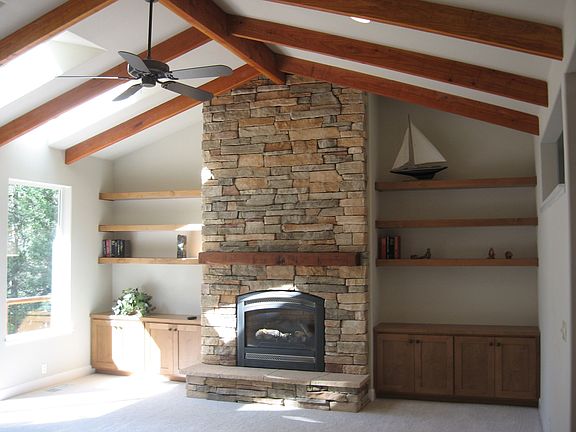 Floor to ceiling stone fireplace with gas insert