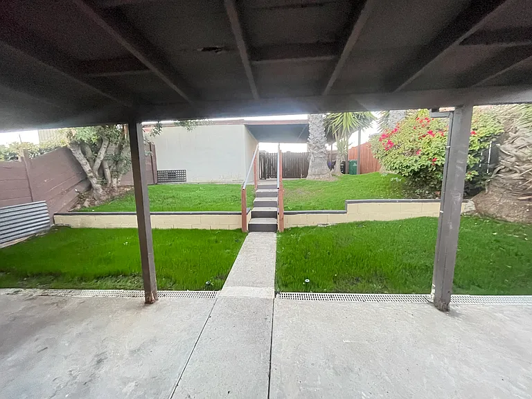 Backyard looking towards carport