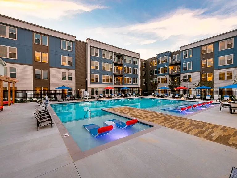 Swimming pool with sundeck and lounge seating