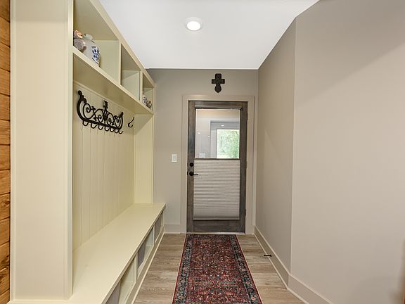 Front door to apt. with versatile privacy shade.