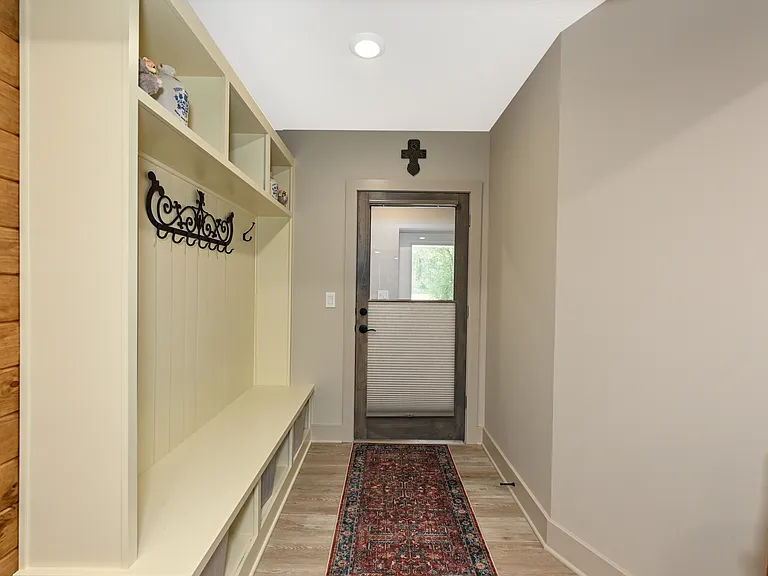 Front door to apt. with versatile privacy shade.