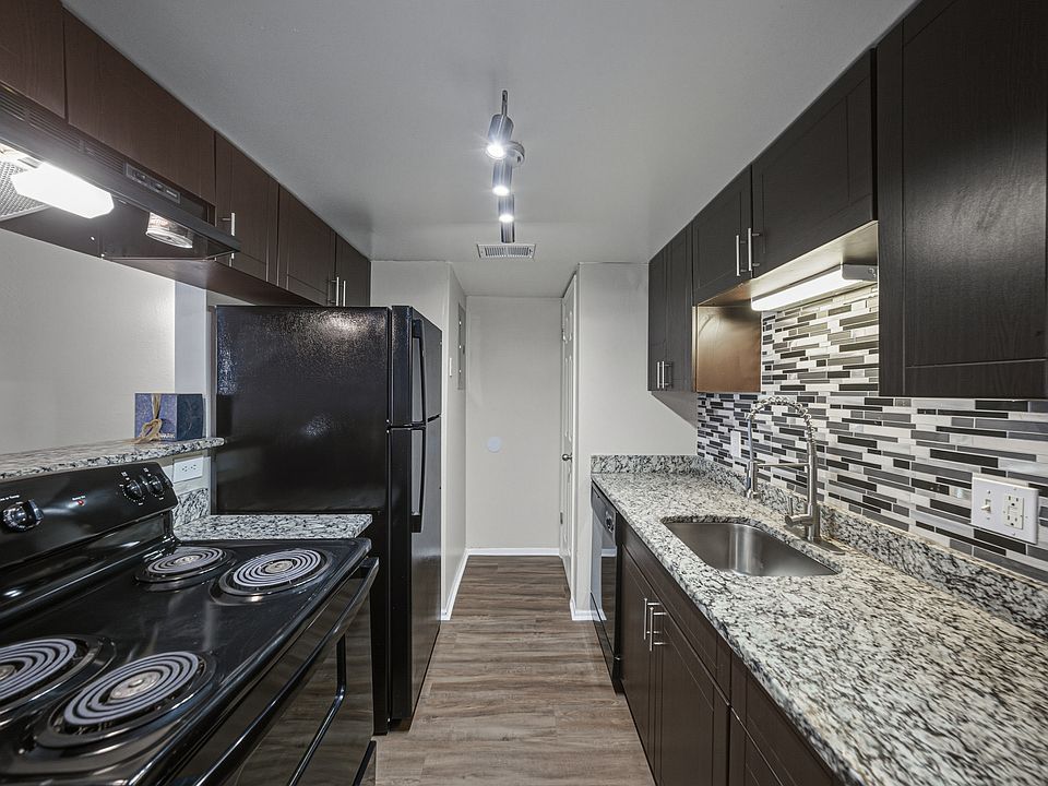 Updated kitchen with granite countertops and modern finishes