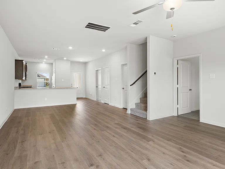 The dining room sits adjacent to the kitchen and living room.