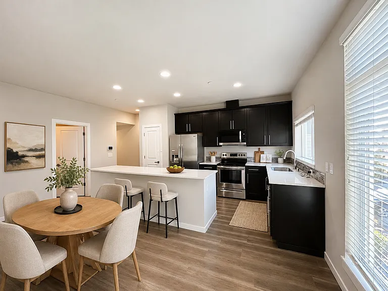 Virtually staged kitchen and dining area.