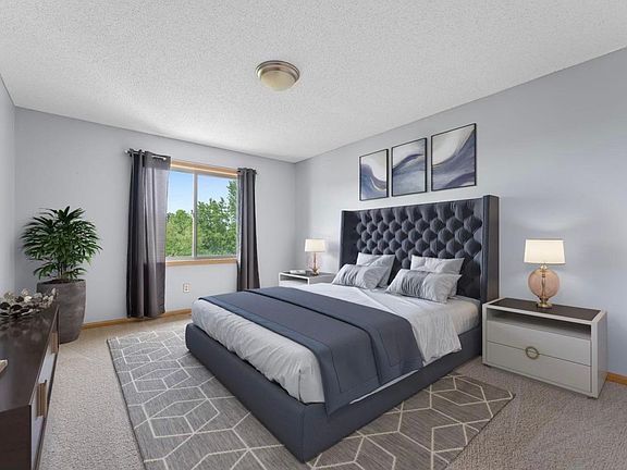 Primary bedroom with walk in closet and attached bath