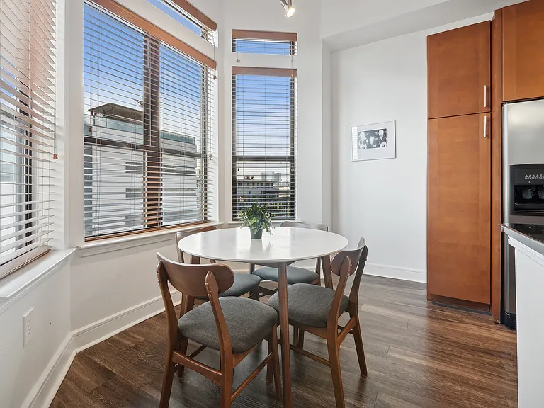 Experience intimate dining in a well-lit space with panoramic city views. Experience intimate dining in a well-lit space with panoramic city views.