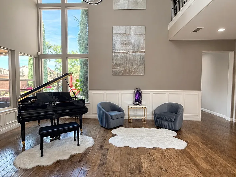 22 foot high foyer with wainscotting trim work