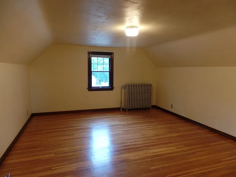 Large Upper Bedroom. Window faces street.