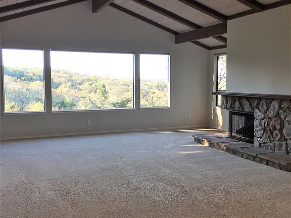 Living room right, with vaulted ceilings.