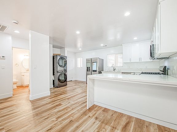 High end kitchen with quartz counters, top of the line appliances and custom built cabinets with soft close.