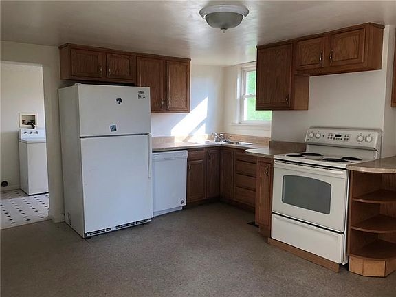 Kitchen leads into the laundry room - easily watch the side yard from the corner sink!