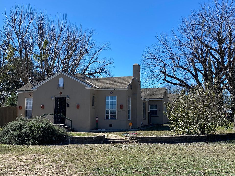 Huge corner lot with large fenced back yard and mature landscaping