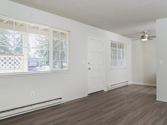 Luxury walnut style plank flooring in a medium brown finish completes this very, very well appointed remodeled apartment