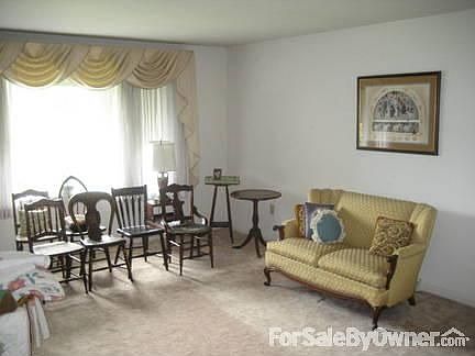 Living Room
						:
						Bay window brings plenty of light into living room.
