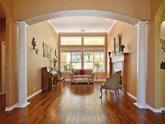 The home is full of natural light with transoms in each room. Custom architectural features are throughout the home.