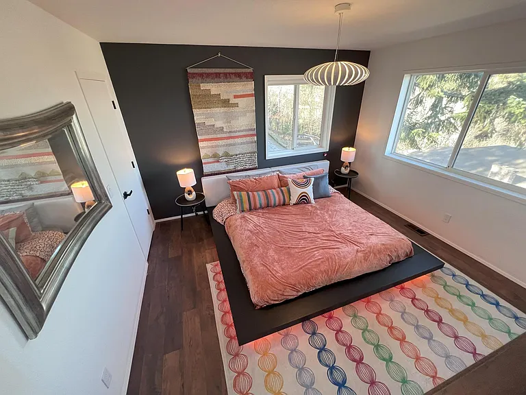 Primary bedroom with floating king bed and super comfy mattress
