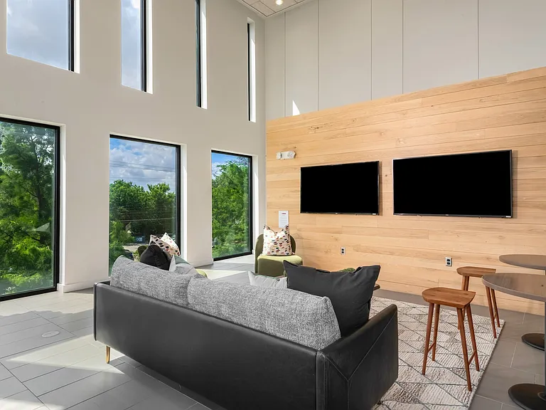 Lounge Featuring TV Wall, Built-In Bench, and Decorative Wood Paneling