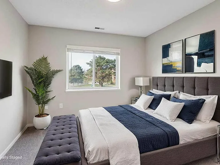Bright, inviting bedrooms create a comfortable retreat for winding down and starting each day feeling refreshed.