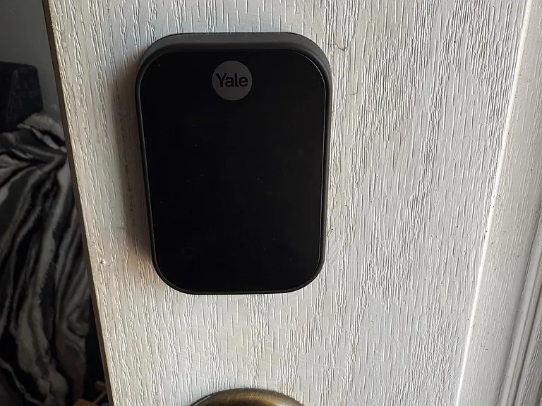 Secure entry with a keyless smart lock for convenient access and added peace of mind for residents.