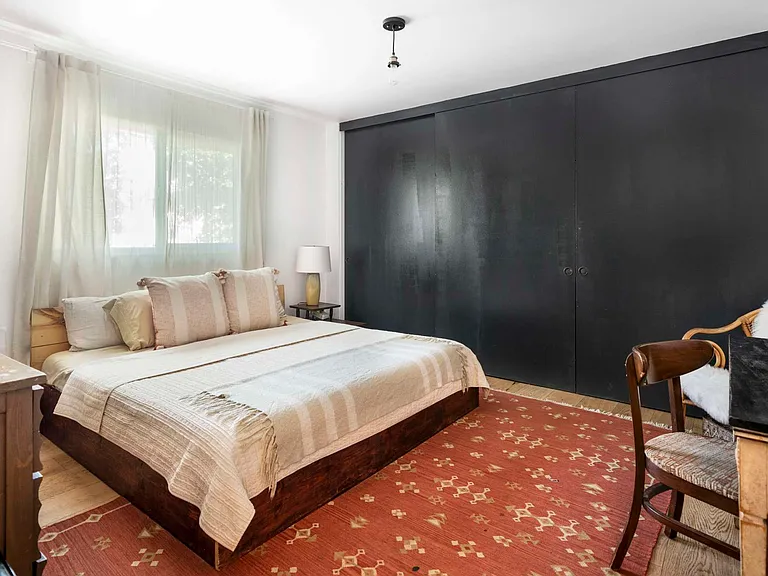 bedroom 2 - oversized closet doors painted dark blue (king size bed)