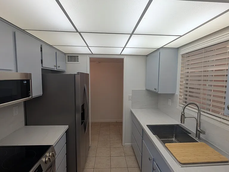 Brand new stainless steel appliances and solid surface counter tops.