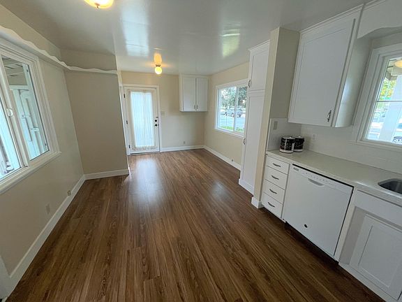 In the kitchen looking toward far end; hook-up for washer dryer is at the end behind the short wall, on the left side of the door.