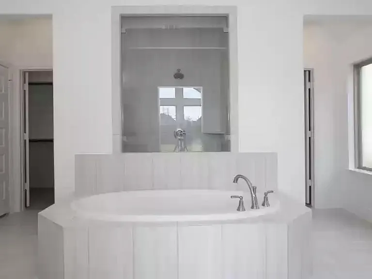 Primary bathroom. walk in closet on each side.