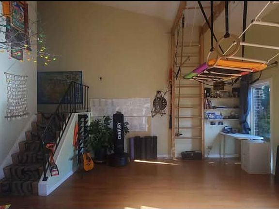 View of the living room and the staircase leading to the 2nd floor from the dining room.