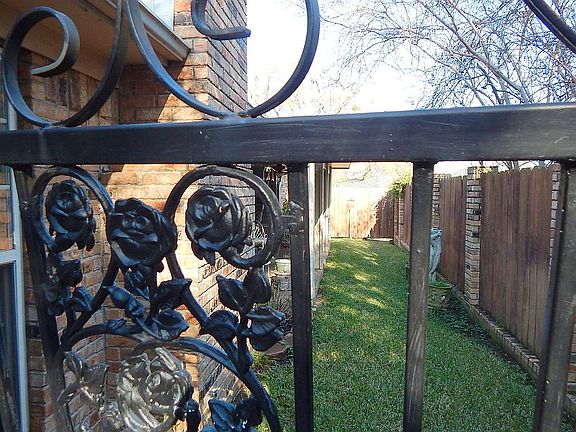 Iron gate to side yard