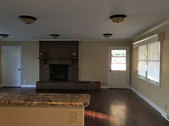 Den view leading into carport