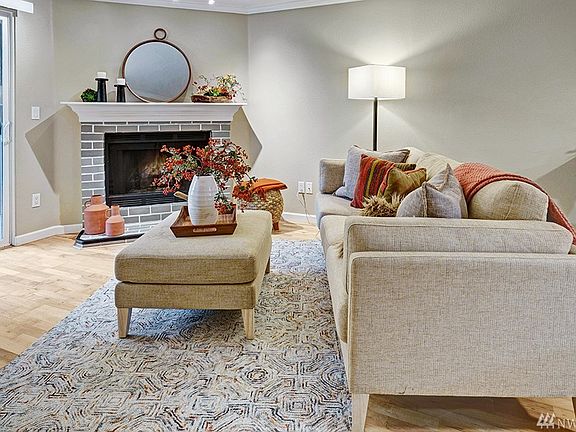 Elegant living room opens to rear slider, leading to your private patio