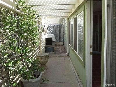 Protected pet run - off enclosed patio