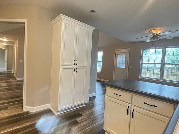 Standing in Kitchen and view of Kitchen Pantry